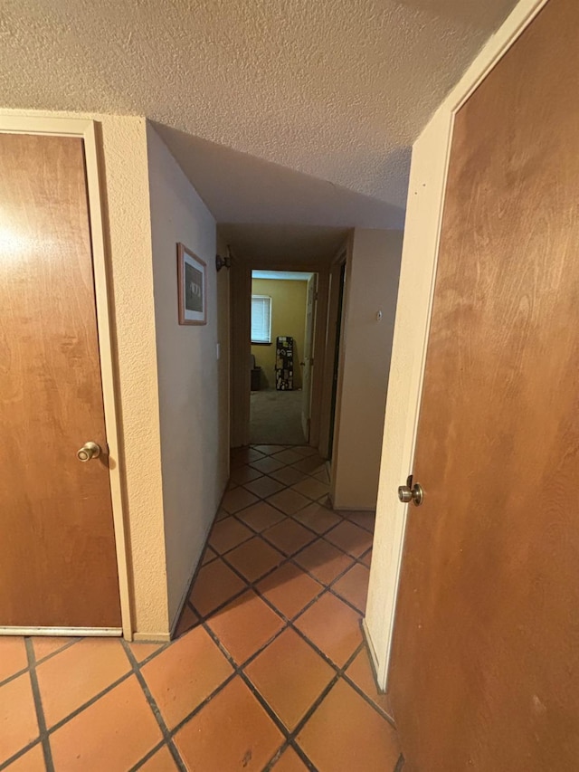 1225 Pontiac Ave, Clovis, CA 93612 - hall with a textured ceiling and light tile patterned flooring
