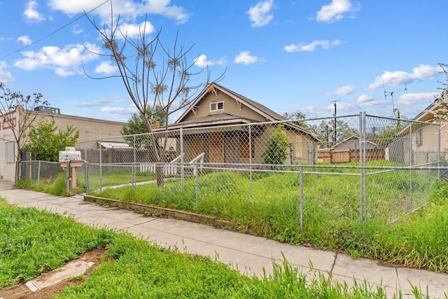view of front of home featuring fence