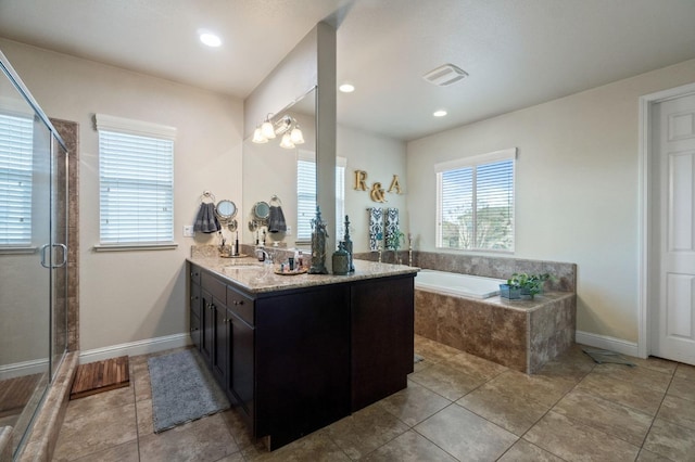 full bathroom with a shower stall, visible vents, a garden tub, vanity, and tile patterned flooring