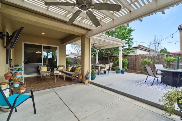 view of patio / terrace with outdoor dining space, a ceiling fan, a fenced backyard, and a pergola