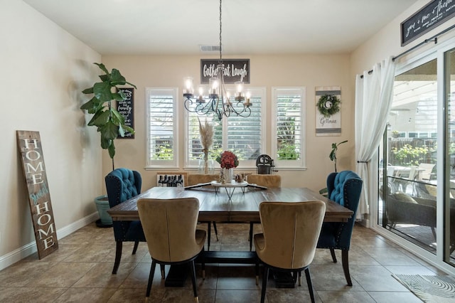 dining space featuring tile patterned flooring, an inviting chandelier, visible vents, and baseboards