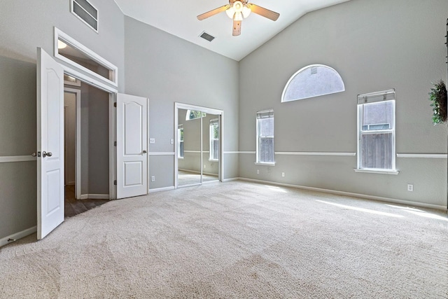 4650 W Roberts Ave, Fresno, CA 93722 - unfurnished bedroom featuring high vaulted ceiling, carpet floors, baseboards, and ceiling fan
