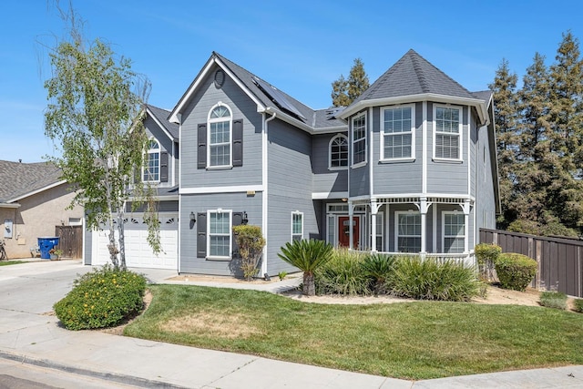 4650 W Roberts Ave, Fresno, CA 93722 - victorian home with solar panels, driveway, and a garage