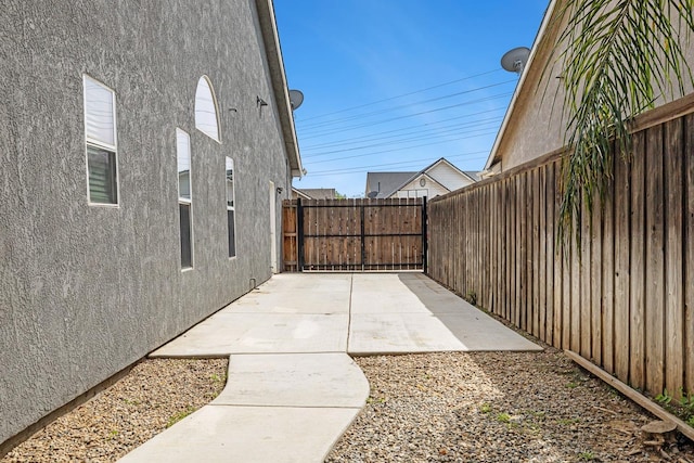 4650 W Roberts Ave, Fresno, CA 93722 - fenced backyard featuring a patio area