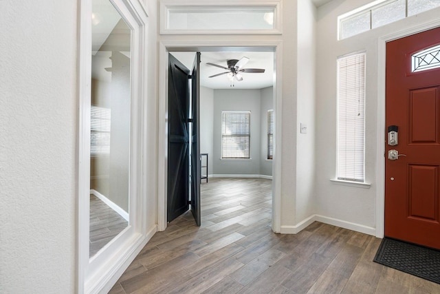 4650 W Roberts Ave, Fresno, CA 93722 - foyer entrance with wood finished floors, baseboards, and a ceiling fan