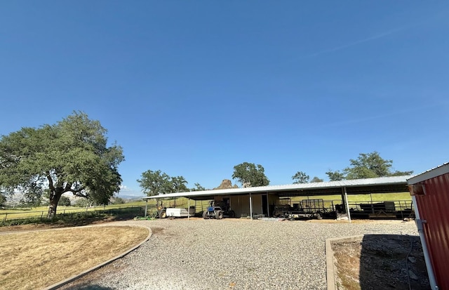rear view of house featuring driveway