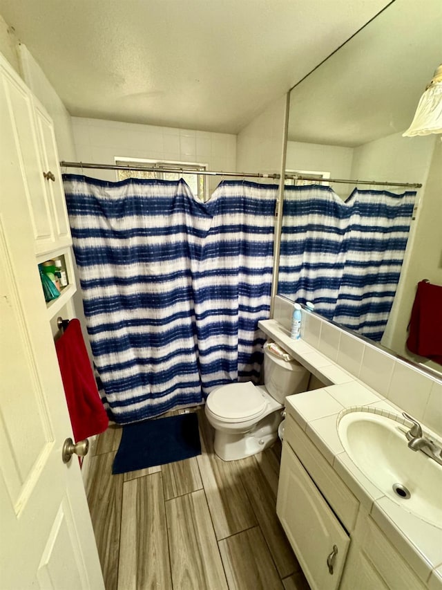 3140 Timmy Ave, Clovis, CA 93612 - bathroom featuring vanity, wood finished floors, and a shower with shower curtain