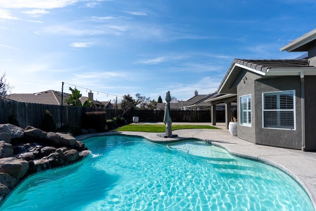 view of pool with a fenced in pool, a patio, and a fenced backyard