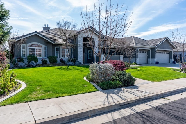 ranch-style house with stucco siding, stone siding, a front lawn, a garage, and a tiled roof