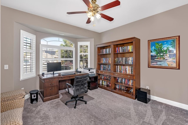 office area with a healthy amount of sunlight, baseboards, and carpet floors