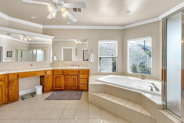 bathroom with a ceiling fan, crown molding, vanity, tile patterned flooring, and a garden tub