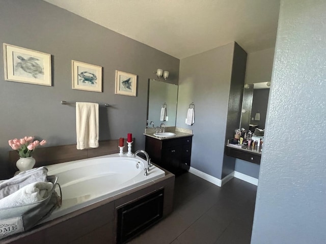 bathroom with vanity and a garden tub