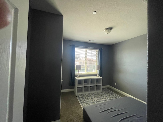 bedroom featuring carpet flooring, visible vents, and baseboards