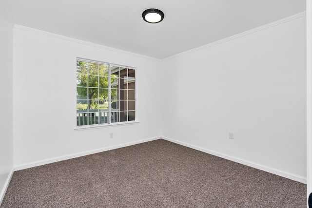 5873 W Wathen, Fresno, CA 93722 - spare room featuring dark carpet, crown molding, and baseboards