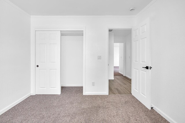 5873 W Wathen, Fresno, CA 93722 - unfurnished bedroom featuring carpet, ornamental molding, baseboards, and a closet