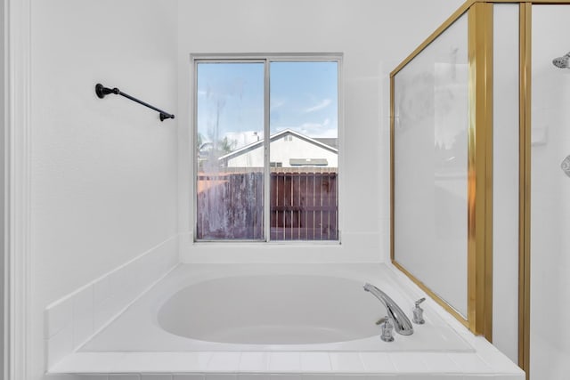 5873 W Wathen, Fresno, CA 93722 - bathroom featuring a garden tub and a shower stall