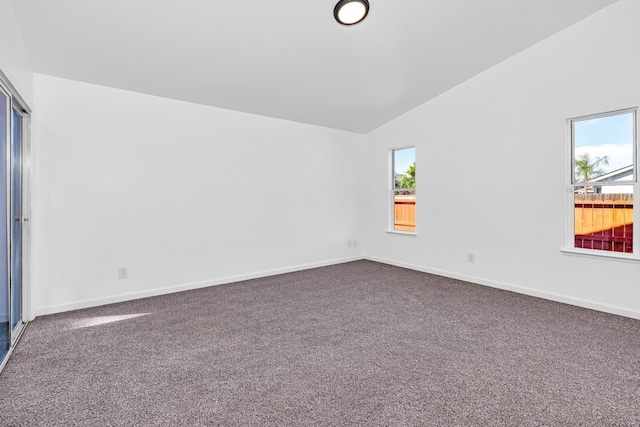 5873 W Wathen, Fresno, CA 93722 - empty room with vaulted ceiling, dark colored carpet, and baseboards