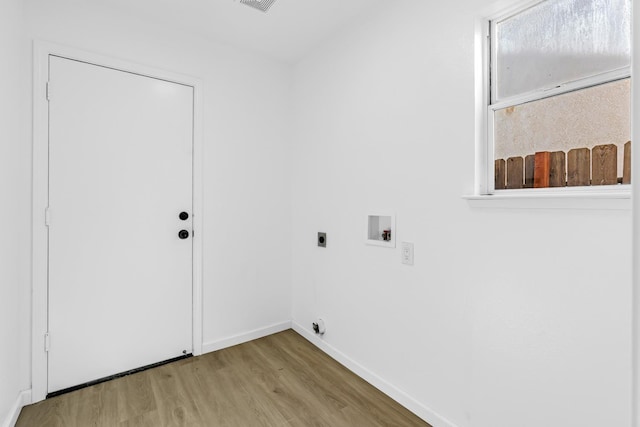 5873 W Wathen, Fresno, CA 93722 - laundry room featuring light wood finished floors, washer hookup, hookup for an electric dryer, and baseboards
