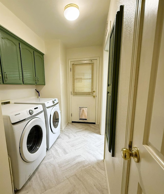 washroom with separate washer and dryer, cabinet space, and baseboards