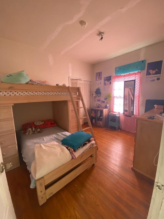 bedroom featuring wood finished floors