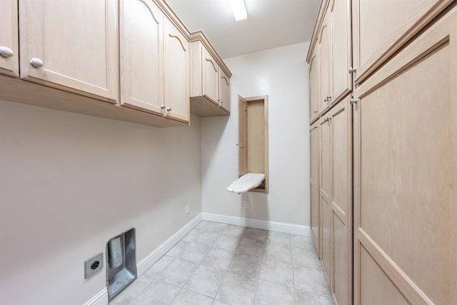 18778 Shore Dr, Madera, CA 93638 - laundry room featuring electric dryer hookup, light tile patterned flooring, baseboards, and cabinet space