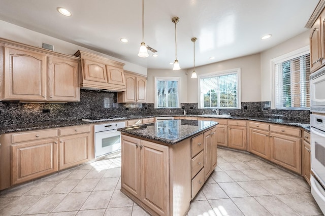 18778 Shore Dr, Madera, CA 93638 - kitchen with tasteful backsplash, white appliances, and light brown cabinetry