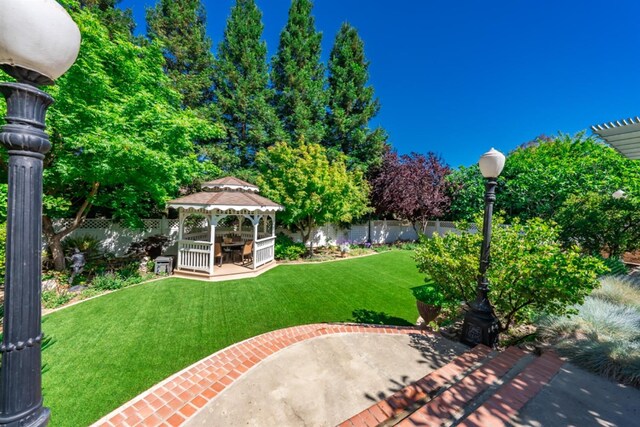 18778 Shore Dr, Madera, CA 93638 - view of yard featuring a gazebo, fence, and a patio