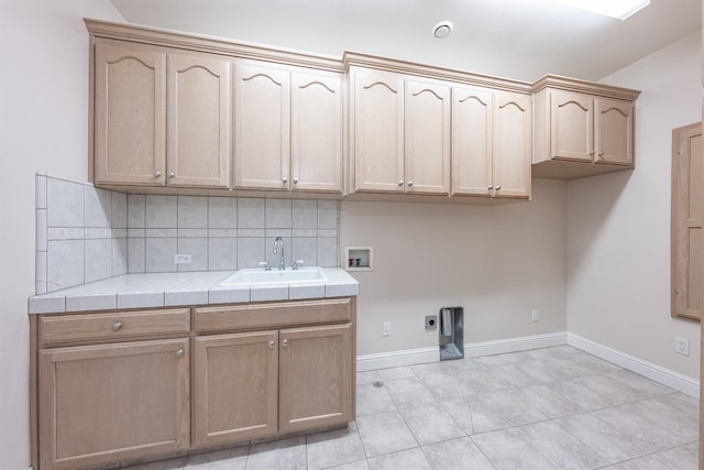 18778 Shore Dr, Madera, CA 93638 - laundry room featuring electric dryer hookup, washer hookup, a sink, baseboards, and cabinet space