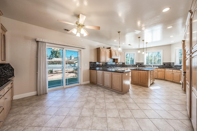 18778 Shore Dr, Madera, CA 93638 - kitchen with light tile patterned floors, backsplash, and recessed lighting
