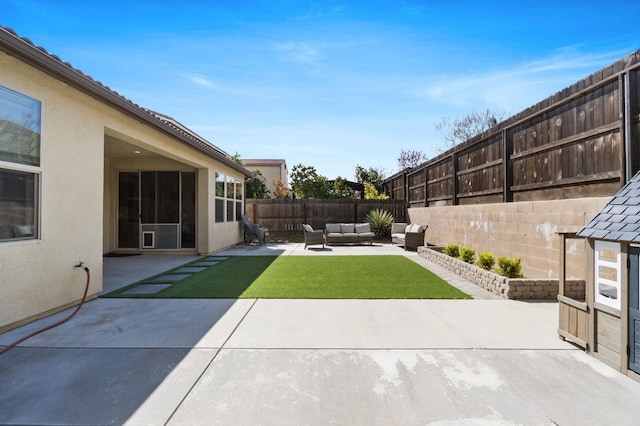 view of yard with outdoor lounge area, a patio area, and a fenced backyard