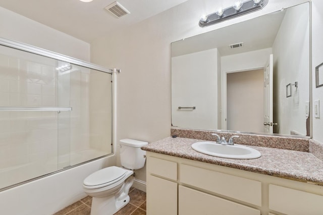 2464 S Kirk St, Fresno, CA 93706 - bathroom with vanity, bath / shower combo with glass door, and tile patterned floors