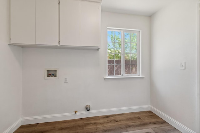 2464 S Kirk St, Fresno, CA 93706 - laundry area featuring hookup for a washing machine, wood finished floors, cabinet space, and gas dryer hookup