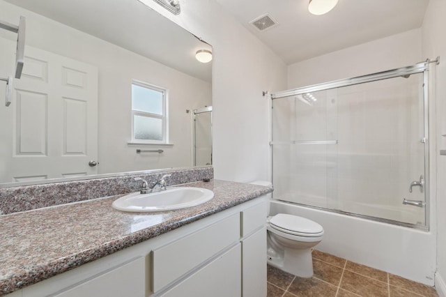 2464 S Kirk St, Fresno, CA 93706 - bathroom featuring vanity, combined bath / shower with glass door, and tile patterned floors
