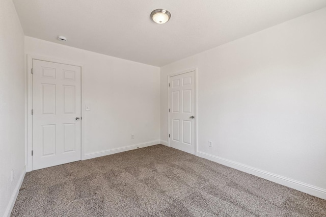 2464 S Kirk St, Fresno, CA 93706 - carpeted empty room featuring baseboards and a smoke detector