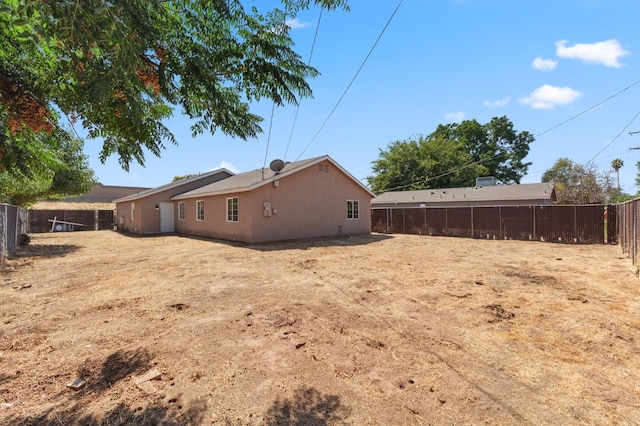 2464 S Kirk St, Fresno, CA 93706 - rear view of property with a fenced backyard