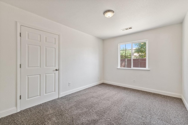 2464 S Kirk St, Fresno, CA 93706 - carpeted empty room featuring baseboards