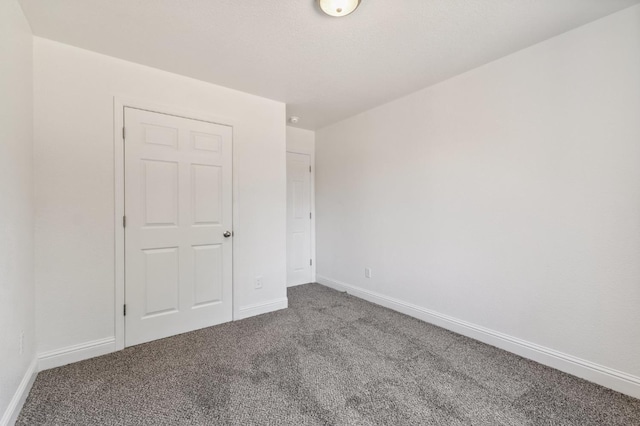 2464 S Kirk St, Fresno, CA 93706 - carpeted empty room featuring baseboards