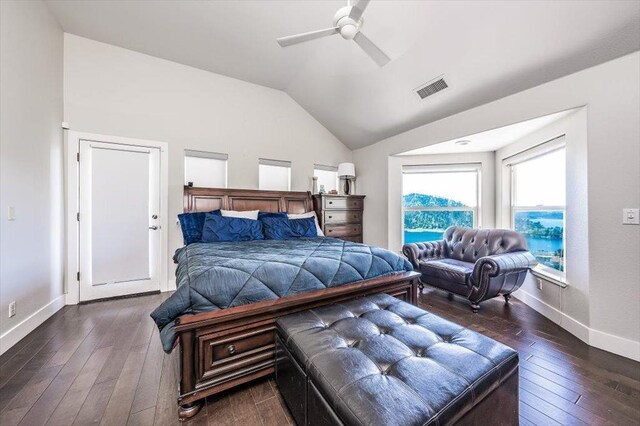 bedroom featuring lofted ceiling, baseboards, visible vents, ceiling fan, and hardwood / wood-style flooring