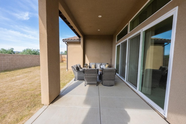 view of patio featuring fence
