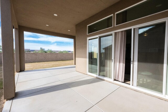 view of patio featuring fence