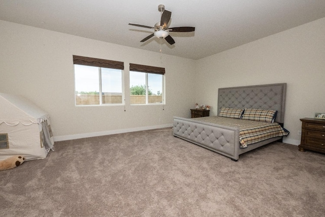 carpeted bedroom with baseboards and a ceiling fan
