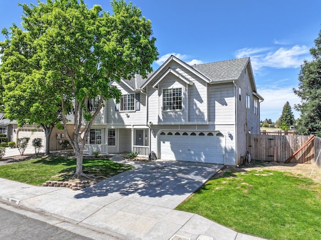 10089 N Baird Ave, Fresno, CA 93730 - traditional home featuring covered porch, a garage, fence, concrete driveway, and a front lawn