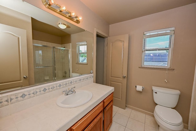 10089 N Baird Ave, Fresno, CA 93730 - full bathroom featuring an enclosed shower, toilet, and plenty of natural light