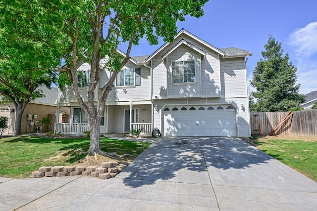 10089 N Baird Ave, Fresno, CA 93730 - traditional home featuring covered porch, fence, a front lawn, an attached garage, and concrete driveway