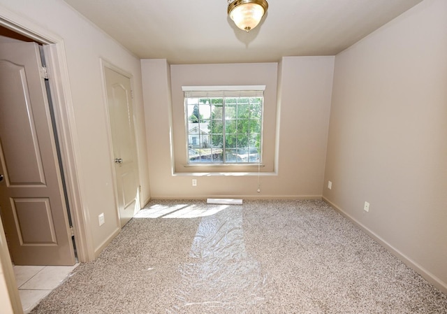 10089 N Baird Ave, Fresno, CA 93730 - unfurnished bedroom featuring light carpet and baseboards
