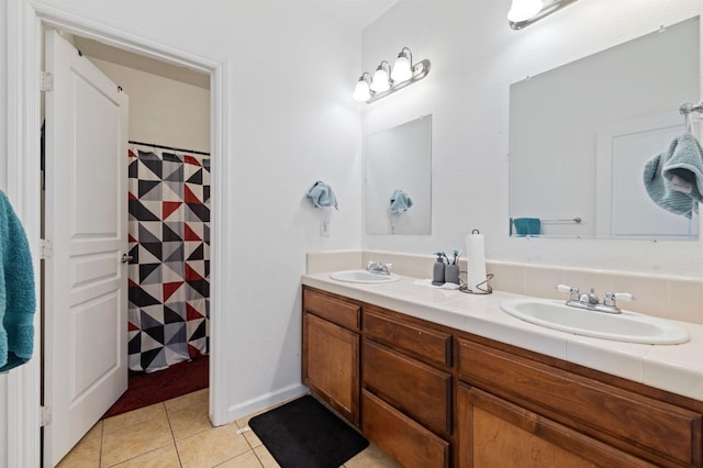 2594 S Duke Ave, Fresno, CA 93727 - bathroom with a sink, double vanity, tile patterned flooring, and a shower with curtain