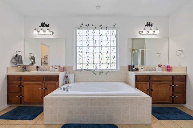 2594 S Duke Ave, Fresno, CA 93727 - full bath with tile patterned floors, a garden tub, a stall shower, and two vanities