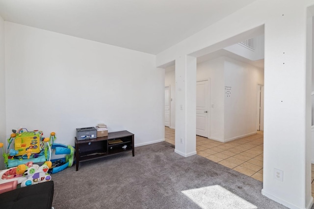 2594 S Duke Ave, Fresno, CA 93727 - recreation room featuring tile patterned flooring, baseboards, and carpet