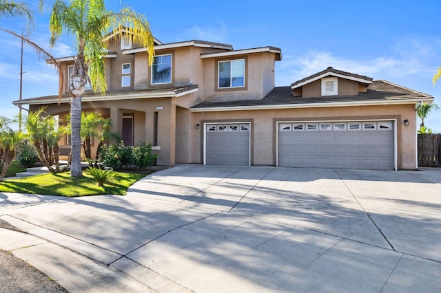 2594 S Duke Ave, Fresno, CA 93727 - traditional-style house with driveway and stucco siding