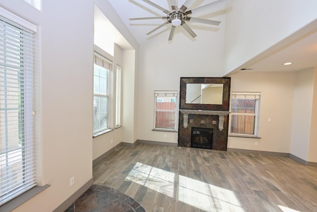 738 Century Ln, Clovis, CA 93612 - unfurnished living room with a fireplace, baseboards, a ceiling fan, and wood finished floors